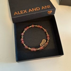 Alex and Ani gold and pink bracelet.